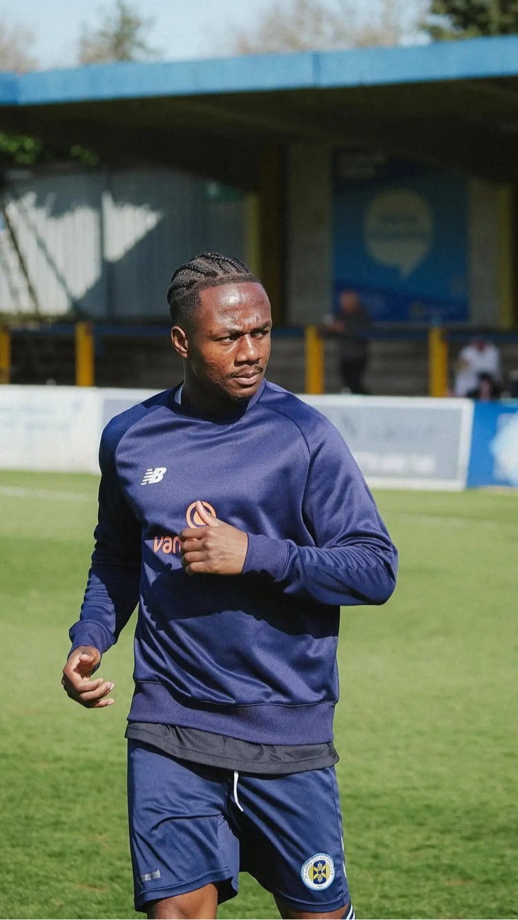 Ken Charles in a blue soccer training kit on a pitch